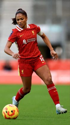 a female soccer player in action on the field