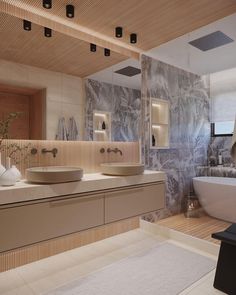 a large bathroom with two sinks and a bathtub