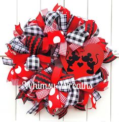 a red and black minnie mouse mesh wreath