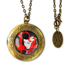 This gorgeous locket keepsake pendant will surely find a special place in any jewelry lovers heart! The round antique bronze locket features a beautiful detailed neo-vintage floral design etched around the inlaid glass focal point. The centered artwork is protected by a crystal clear domed glass cab. The locket pendant hangs from a 24 inch antique bronze linked curb chain with a lobster clasp closure. Each necklace is adorned with a limited edition KK jewelry tag. This locket is perfect for hold Verre Design, Vintage Floral Design, Japanese Geisha, Dragon Necklace, Jewelry Tags, Cufflink Set, Locket Necklace, Curb Chain, Design Floral