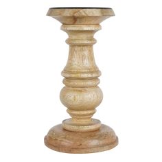 a wooden candle holder sitting on top of a table