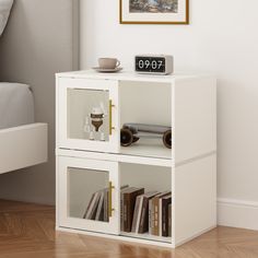 a white book shelf with books on it