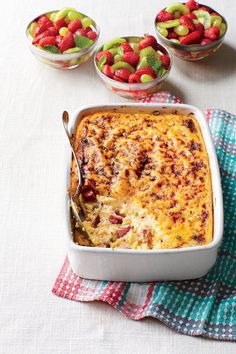 a casserole dish with fruit on the side