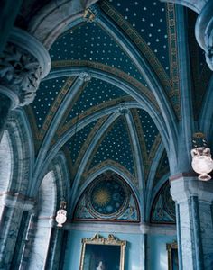 an ornate room with blue walls and ceiling