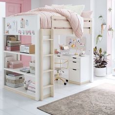 a white bunk bed sitting next to a desk and chair in a room with pink walls