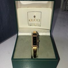 Vintage Gucci Watch Style 1500l Gold With Black Face Original Packaging Excellent Used Condition Minor Wear On Band, No Scratches On Face 6.25” Around Will Need New Battery Gucci Gold Watch For Gift, Gucci Vintage Watch, Designer Gucci Yellow Gold Watch, Luxury Gold Gucci Watch, Gucci Apple Watch Band, Vintage Gucci Watch Interchangeable, Gucci Bracelet, Charm Bracelet Watch, Floral Watches