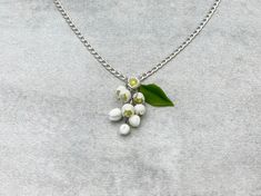 "Lily of the valley flower pendant for every lovely day. The life of the real lily of the valley flowers is too short to make some necklaces with them. Instead of real flowers, I offer you these beautiful handmade that will never fade. Such a piece of floral jewelry can please you for many years. It will beautifully adorn your look in any season of the year. Details: * Designed with handmade flowers out of cold porcelain (air dry clay); * Lenght of the pendant is about 1.2 inches (3 cm); * Chain White Flower Necklace With Nature-inspired Style, White Flower-shaped Nature-inspired Necklace, Handmade Delicate Flower Pendant Charm Necklace, White Flower Charm Necklace Handmade, Charming Handmade White Necklace, Charming Handmade White Necklaces, Charming White Handmade Necklaces, Poppy Necklace, Lily Of The Valley Flowers