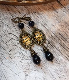 These dangle Victorian style earrings with flower pattern glass cabochon finished with black teardrop are sure to nice accent any of your favourite style outfits and a unique gift idea . This pair is also lightweight, which makes them especially comfortable to wear as they add a complete the look to your outfits! length 2.1 inches (6 cm) You can complete the look with a necklace- choker: https://www.etsy.com/ie/listing/898608541/black-victorian-style-velvet-choker-with                        or Victorian Style Earrings, Cabochon Earrings, Velvet Choker, Pattern Glass, Black Flower, Necklace Choker, Earrings Black, Style Earrings, Victorian Style