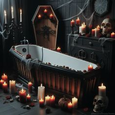 a bathtub filled with candles next to a bunch of skulls and other items on the floor