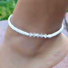 Anklet is made with 6mm high end European crystals and white cord. Has an adjustable chain for perfect sizing Adjustable White Crystal Beaded Bracelets, Adjustable Crystal Anklets As Gift, Adjustable Beaded Crystal Bracelet For Summer, Adjustable Crystal Jewelry For Summer, Adjustable White Crystal Bracelet, Adjustable White Beaded Anklets, Surprise Gift, Anklet Jewelry, Beach Summer