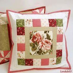 two decorative pillows made to look like quilts with roses on the front and back