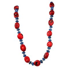 Unique Southwest-Inspired Necklace of Red Coral and Blue Kyanite Elevate your accessory game with this unique Southwest-inspired necklace, artfully crafted with red coral and blue kyanite, and adorned with intricate silvery spacers. This stunning piece seamlessly blends vibrant colors and textures, making it a standout addition to any jewelry collection. Key Features: Vibrant Color Palette: The necklace features deep red bamboo coral, gently faceted to showcase its natural beauty, complemented b Artisan Red Necklaces For Jewelry Making, Unique Red Gemstone Bead Necklaces, Artisan Red Necklace With Polished Beads, Artisan Red Necklaces With Polished Beads, Unique Single Strand Red Beaded Necklace, Unique Red Single Strand Beaded Necklace, Artisan Red Coral Necklaces For Jewelry Making, Blue Red Coral Jewelry As Gift, Blue Jewelry With Red Coral As A Gift