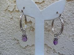 Amethyst hoop earrings 1 1/8" in diameter, cast and antiqued in sterling silver 925 with lever type ear wires, it has 8mm by 12mm amethyst briolettes, capped in sterling silver...from the ear wire to the end of the briolette it is 1 3/4" total...well made earrings Purple Amethyst Hoop Jewelry, Nickel-free Purple Hoop Earrings, Adjustable Nickel-free Purple Hoop Earrings, Nickel-free Purple Dangle Hoop Earrings, Purple Nickel-free Dangle Hoop Earrings, Adjustable Purple Jewelry With Lever Back Ear Wires, Hand Forged Round Amethyst Jewelry, Hoop Earrings Handmade, Moon Studs