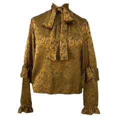 Yves saint Laurent shirt. Vintage piece. In golden silk with baroque pattern. French size 36 which corresponds to an Italian 40 but fits like a 42. measurements: shoulders 43 cm bust 50 cm length 59 cm sleeve 67 cm in very good condition. Small issue in the brand tag as you can see in the photos. Yves Saint Laurent Shirt, Saint Laurent Shirt, Saint Laurent Vintage, Baroque Pattern, Silk Camisole, Brand Tags, Silk Shirt, Yves Saint Laurent, Saint Laurent