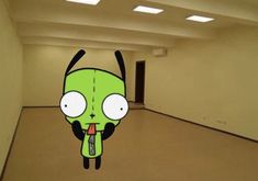 an animated image of a green alien with eyes and tongue sticking out from its mouth