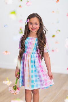 *Please refer to size chart for the best fit* Girls' Easter dress features a stretchy, smocked bodice Puff sleeves with elastic cuffs Ultra-soft material for comfort & ease Pull-over style for fit & easy dressing Add sweet fluttery style to her Easter look with this Pastel Rainbow Gingham Flower Dress. This girls' dress is styled with an adorable plaid flower pattern for an adorable look. This short sleeve design makes it a staple addition to her Easter wear, while the pull-over style allows for simple dressing. Pair this darling dress with a matching SIP bow or a pair of sandals for the perfect look! bullets:Includes: Dress only 100% Polyester Spring Playful Smocked Dress With Smocked Bodice, Playful Smocked Dress For Spring With Smocked Bodice, Playful Smocked Dress With Smocked Bodice For Spring, Casual Multicolor Dresses With Elastic Sleeves, Cute Multicolor Smocked Dress For Spring, Playful Smocked Dress For Spring, Playful Fitted Smocked Dress For Spring, Playful Multicolor Dress With Smocked Back, Playful Multicolor Dress With Smocked Bodice