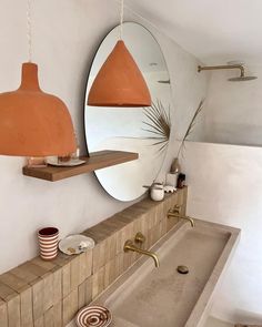 a bath room with a sink and a mirror on the wall next to a bath tub