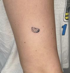 a person with a small tattoo on their arm