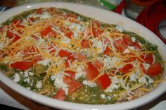 a white bowl filled with food on top of a table