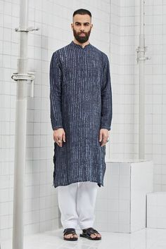 Navy blue straight long kurta with 4- button placket, cuff sleeves and hand made detachable pea- buttons. Comes with contrast pants.
Component: 2
Shibori
Neckline: Mandarin Collar
Sleeve Length: Full
Fabric: Line
Color: Blue
Side slit
Button placket
Striped pattern - Aza Fashions Men's Closet, Kurta Set For Men, Men Kurta, Indian Look, Men Closet, Nehru Jacket, Nehru Jackets, Blazer Designs, Kurta Set