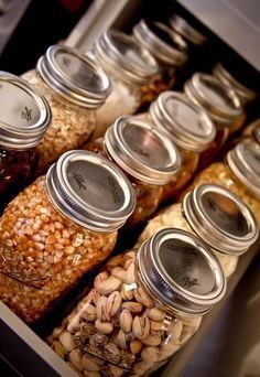 jars filled with different types of beans and nuts