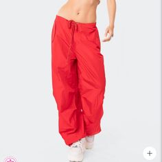 Size Is Xs/S Parachute Pants Drawstring Waistband Drawstring Ankles Cargo Pockets Nylon Model Wears Size Xs/S Model Height Is 5'9 Item Care: Wash With Similar Color High Waist Nylon Sports Pants, Red Athleisure Bottoms For Streetwear, Trendy Solid Nylon Pants, Sporty Summer Full-length Parachute Pants, Red Drawstring Pants For Streetwear, Red Wide Leg Sweatpants For Streetwear, Red Sporty Pants With Drawstring, Sporty Red Pants With Drawstring, Red Drawstring Bottoms For Streetwear