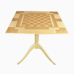 a wooden table with a chess board on it's top and two small legs