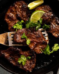 steak with cilantro and lime in a skillet