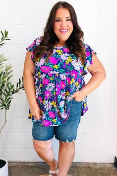 Brighten your closet with this colorful floral print top sporting a round neck and ruffle flutter short sleeves. Step into style this summer with this stunning and vibrant babydoll top! Floral Print + Round Neck + Ruffle Flutter Sleeve + Babydoll Style Stretch 96% POLYESTER 4% SPANDEX Designed in Los Angeles Imported Fits True to Size Weight: .438 lb; Plus Weight .563 Lbs Bust (side to side): S 21" M 22" L 23" 1X 25" 2X 26" 3X 27" Length (shoulder to hem): S 27" M 28" L 29" 1X 31" 2X 32" 3X 33" Floral Babydoll Top, Kids Activewear, Denim Short Dresses, Babydoll Style, Lilac Color, Top Floral, Floral Print Tops, Babydoll Top, Denim Leggings