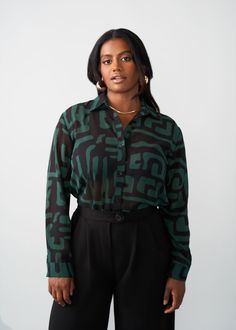 Style#: 5024/P5024 Jazz up your work fit with the Zoela Women's African Print Sheer Blouse in the Black Malachite Geometric print—an African twist to a classic sheer button-up blouse that is sure to add flavor to your wardrobe. Features: Self-lined Buttons at sleeve cuff Pointed collar 100% Polyester​ Sheer, lightweight fabric Designed in the USA, imported Care Instructions: Machine wash cold on gentle cycle with non-chlorine detergent. Hang to dry. Do not bleach. Iron on low. Models: Size: XS H Black Sheer Blouse, Sleeve Cuff, Mens Fall, Workout Accessories, Printed Bags, Blouse Black, Sheer Blouse, Swimwear Accessories, Womens Fall