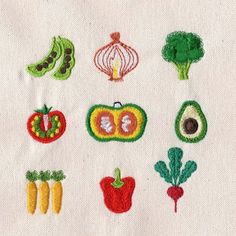 embroidered vegetables and fruits on white fabric