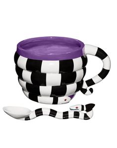 the black and white checkerboard pattern is next to a purple bowl with spoons