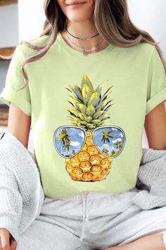 Summer Pineapple Graphic T Shirt.Unisex, Crew Neck, Short Sleeve Tee. 100% COTTON HEATHER(52%COTTON,48%POLY) ATH.HEATHER,BLACK HEATHER(90%COTTON,10%POLY) Imported Summer Tropical Print T-shirt For Beach, Spring Summer Tropical Print T-shirt, Cotton Tropical Print T-shirt, Cotton Tropical Printed T-shirt, Pineapple Graphic, Tropical Multicolor Graphic T-shirt, Holiday Graphic Tees, Patriotic Tees, Jean Accessories