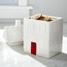 a white box with cookies in it sitting on a table