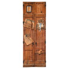 an old wooden door with pictures on it