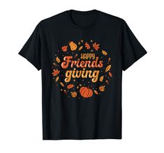 a black t - shirt with the words happy friends giving surrounded by autumn leaves and pumpkins