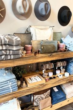 hats and clothing are on display in a store