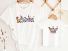 Introducing our super cute Wild Flower birthday t-shirts, for a girls' wild one party. These shirts are high quality and made with 100% soft ringspun cotton for very comfortable wear.   HOW TO ORDER 1. Select the color and size/name from the drop-down menu and add it to the cart 2. Repeat the process if you want to order more shirts 3. If you want a custom shirt, please select that from the menu and add the name to the personalization box NB: We have multiple options for Mom and Dad in the listi Playful Multicolor T-shirt For First Birthday, Fun Cotton Tops For First Birthday, Cute Letter Print Top For First Birthday, Cute Shirt With Graphic Print For First Birthday, Cute Graphic Print Shirt For First Birthday, Cute Graphic Print Top For Birthdays, Playful T-shirt For First Birthday In Spring, Spring First Birthday Tops With Letter Print, Fun White Tops For First Birthday