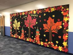 a wall with fall leaves painted on it and the words give thanks written in large letters