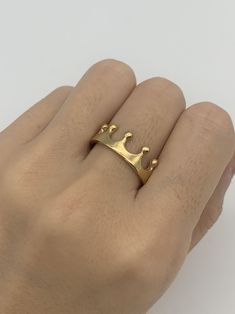 Gold Crown ring made of Gold Vermeil: 18k Gold over Solid 925 Sterling Silver ☞ made to last.Matching Ring - Please ask meMatching Earrings - Please ask meDetails:• Gold Crown Ring• Dimensions: Band Width 7.1mm, Thickness 1.3mm • 18k Gold VermeilSKU TE-093 Gold Ring Crown, Crown Gold Ring, Gold Crown Ring, Crown Rings, Ring Crown, Queen Rings, Crown Gold, Tiara Ring, Princess Ring