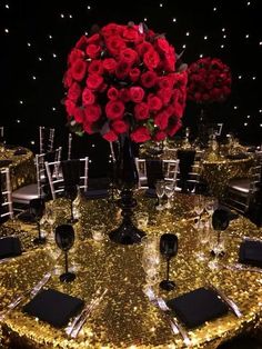 the table is decorated with gold sequins and red roses