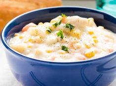 a blue bowl filled with macaroni and cheese