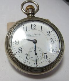 The Hamden John Hancock  antique watch was made in 1898. It is a open face  21 jewel. Has the s/n 1204179. Has 5 adjustments and is rail road grade. Comes with a silverine case and a double sunk dial. The dial where the second had is has a small repair at 3: Oclock. The piece runs but didn't check it for time. The movement has a wonderful engine turning design. Antique Chronometer Watch, Antique Round Watches With Skeleton Dial, Antique Chronometer Watch For Anniversary, Antique Anniversary Watch With Chronometer, Antique Round Pocket Watch With Subdials, Antique Collectible Chronometer Pocket Watch, Antique Round Pocket Watch For Anniversary, Antique Pocket Watch With Chronometer For Formal Occasions, Antique Chronometer Pocket Watch For Formal Occasions