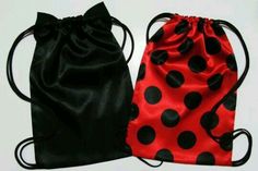 two bags with black and red polka dots on them