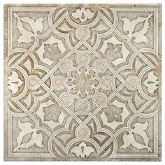 an intricate tile design in grey and white