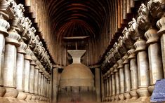 the inside of an ancient building with columns