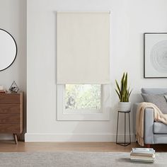 a living room with white walls and furniture