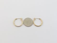 "Offering here is a pair of fabulous 14k yellow gold hoop earrings!! Purity : 14k yellow gold, Tested and stamped Measurements : 5/8\" in diameter or 17 mm wide by 1.5 mm thick. Closure: Hinged post and omega catch. Weight: 0.6 gram Complementary Gift Box These earrings are about the same size as a dime. Images may be enlarges to show details.Please pay attention to the photos and read description before the purchase. I ask you earnestly to make sure about measurements such as size , thickness, 14k Yellow Gold Huggie Hoop Earrings, Small Hoop Earrings In Stamped 14k Gold, Small Hoop 14k Gold Earrings Stamped 14k, 14k Stamped Yellow Gold Hoop Earrings, Stamped 14k Yellow Gold Hoop Earrings, 14k Stamped Yellow Gold Round Hoop Earrings, Stamped 14k Yellow Gold Round Hoop Earrings, Oval Yellow Gold Hoop Earrings Stamped 14k, Oval 14k Stamped Yellow Gold Hoop Earrings