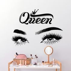 the wall sticker is decorated with an image of eyes and words that say queen