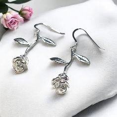 Materials: * Platinum Plated Rose Charms * Sterling Silver Ear Wires Stunning Silver Rose Earrings with Sterling .925 Sterling Silver Ear wires. The Rose Charms are Platinum plated so they will remain shiny, bright and tarnish free with proper care. The Rose Charms as well as the Sterling Silver Ear Wires are Nickel Free, Lead Free and Cadmium Free.  I make these lovely earrings in gold as well. Please choose the color you would like from the drop down menu. These beautiful earrings come with ru Rose Jewelry Flower, Jewelry Flower, Earrings Summer, Jewelry Bridesmaid, Etsy Bridesmaid Gifts, Earrings Flower, Rose Jewelry, Summer Earring, Flower Jewelry